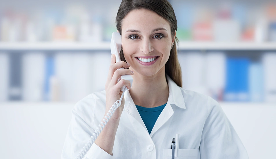 Friendly clinic receptionist providing patient support over the phone