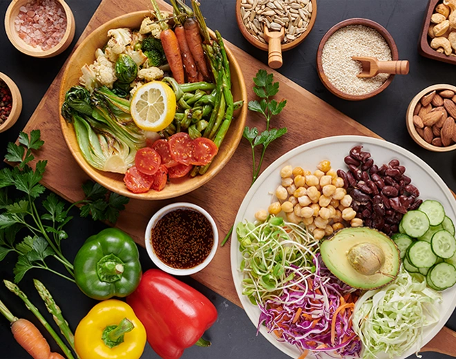 Colorful plant-based meal with fresh vegetables, legumes, avocado, nuts, and seeds for a healthy balanced diet